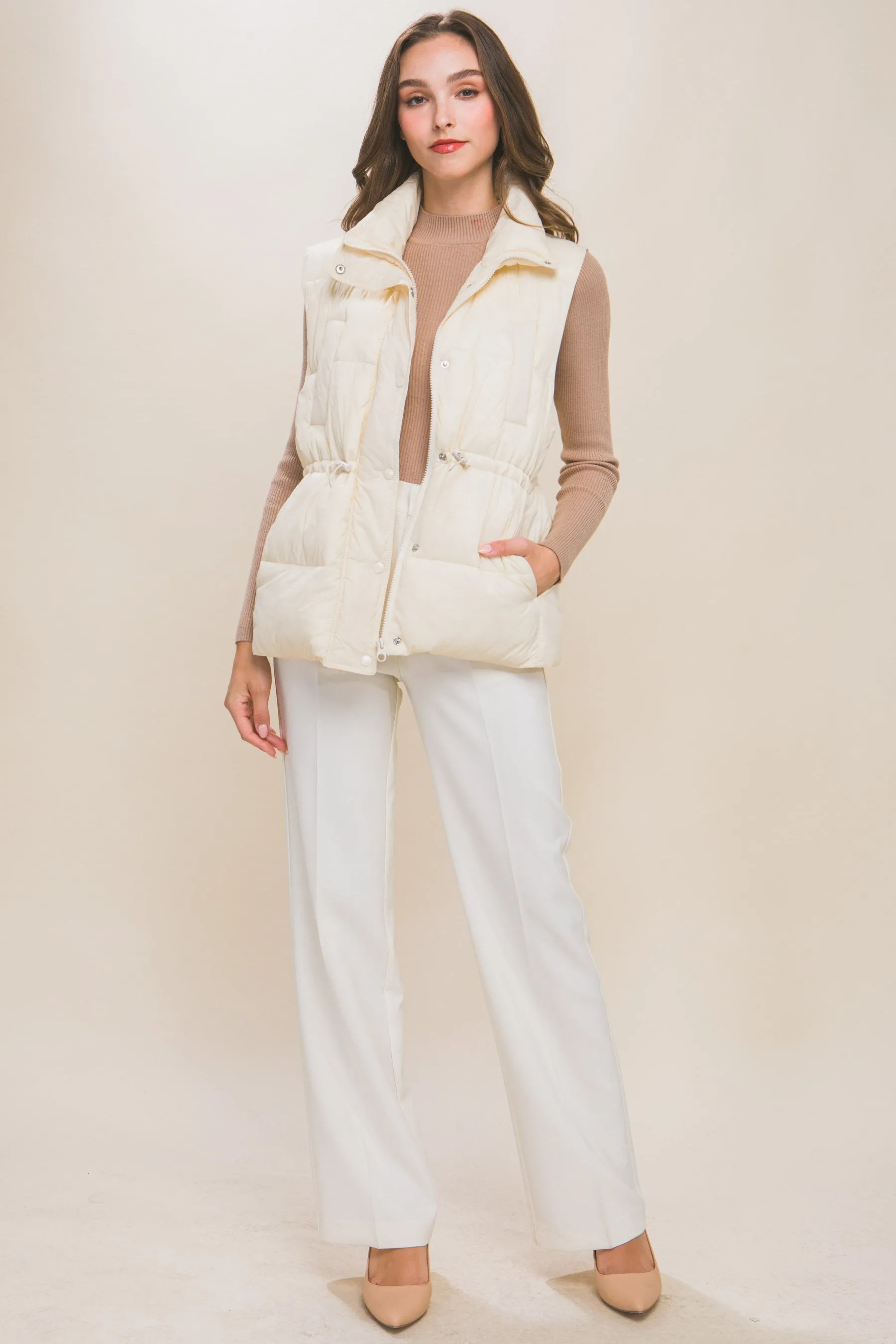 Women's Color Zip up button puffer vest with waist toggles