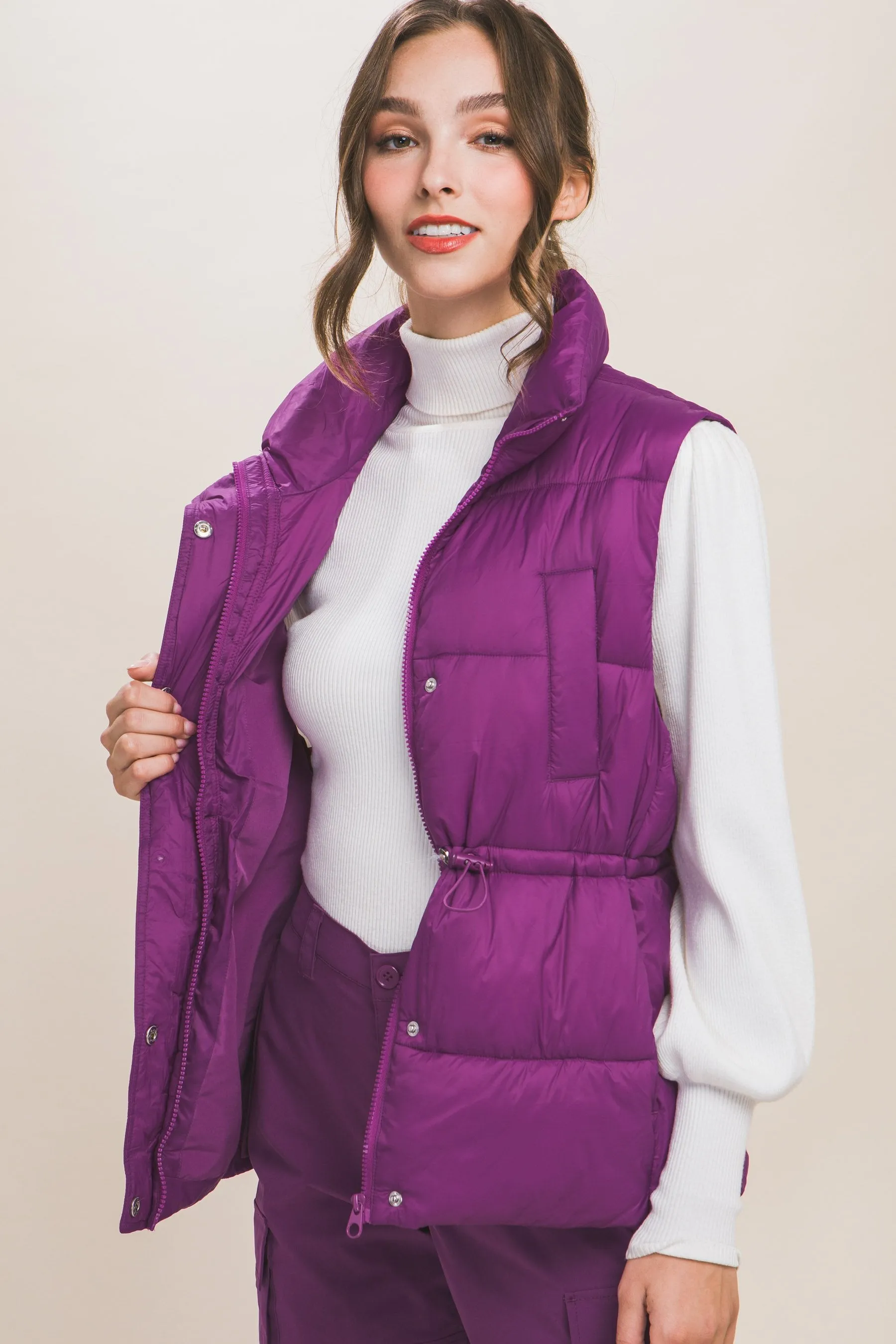 Women's Color Zip up button puffer vest with waist toggles